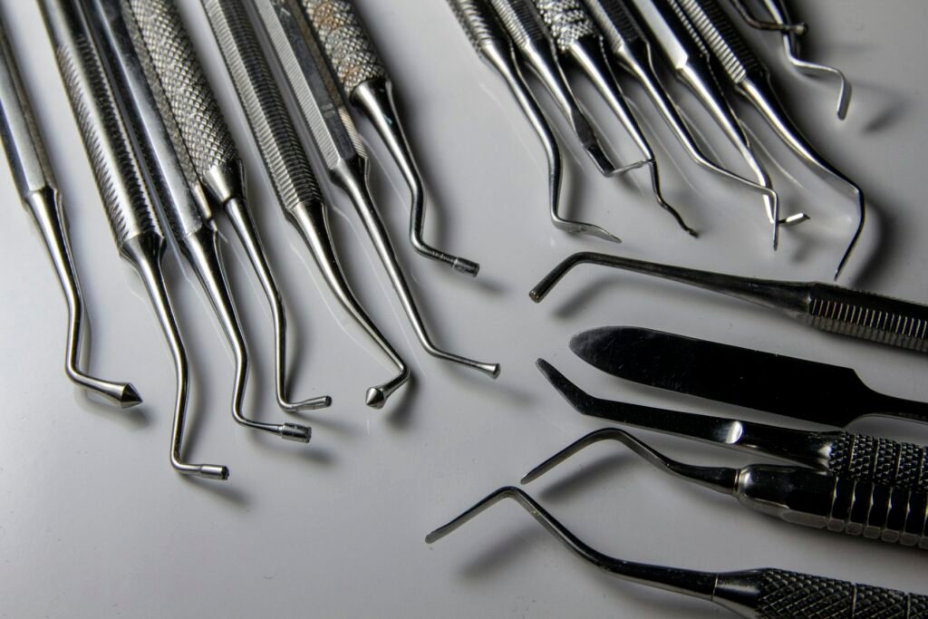 Stainless steel surgical instruments laid out on a table